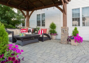 Finished DIY gravel patio floor with budget friendly outdoor seating